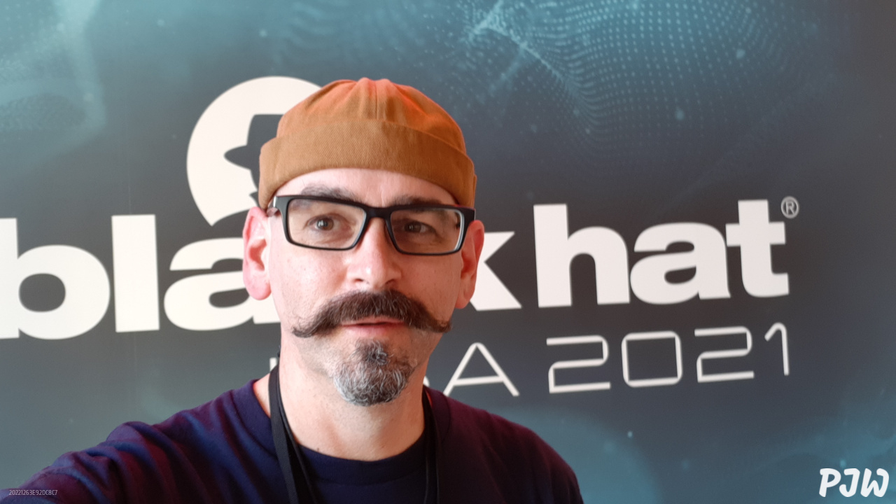 Selfie of Peter Woods in front of BlackHat 2021 sign