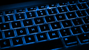 Black keyboard with blue LED lettering and backlighting