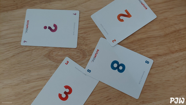 4 Scrum estimating cards on a table