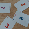 4 Scrum estimating cards on a table