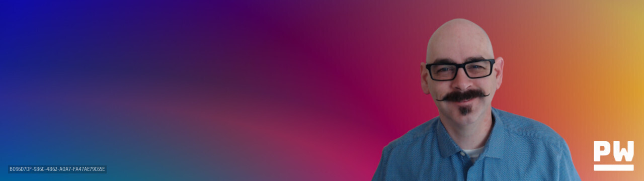 Peter Woods selfie with color gradient Peter Woods in front of bright color gradient